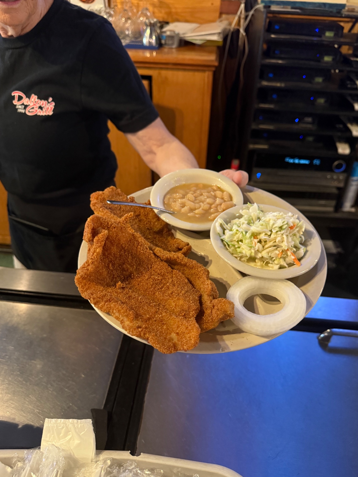 Fried catfish fillets with white beans and coleslaw