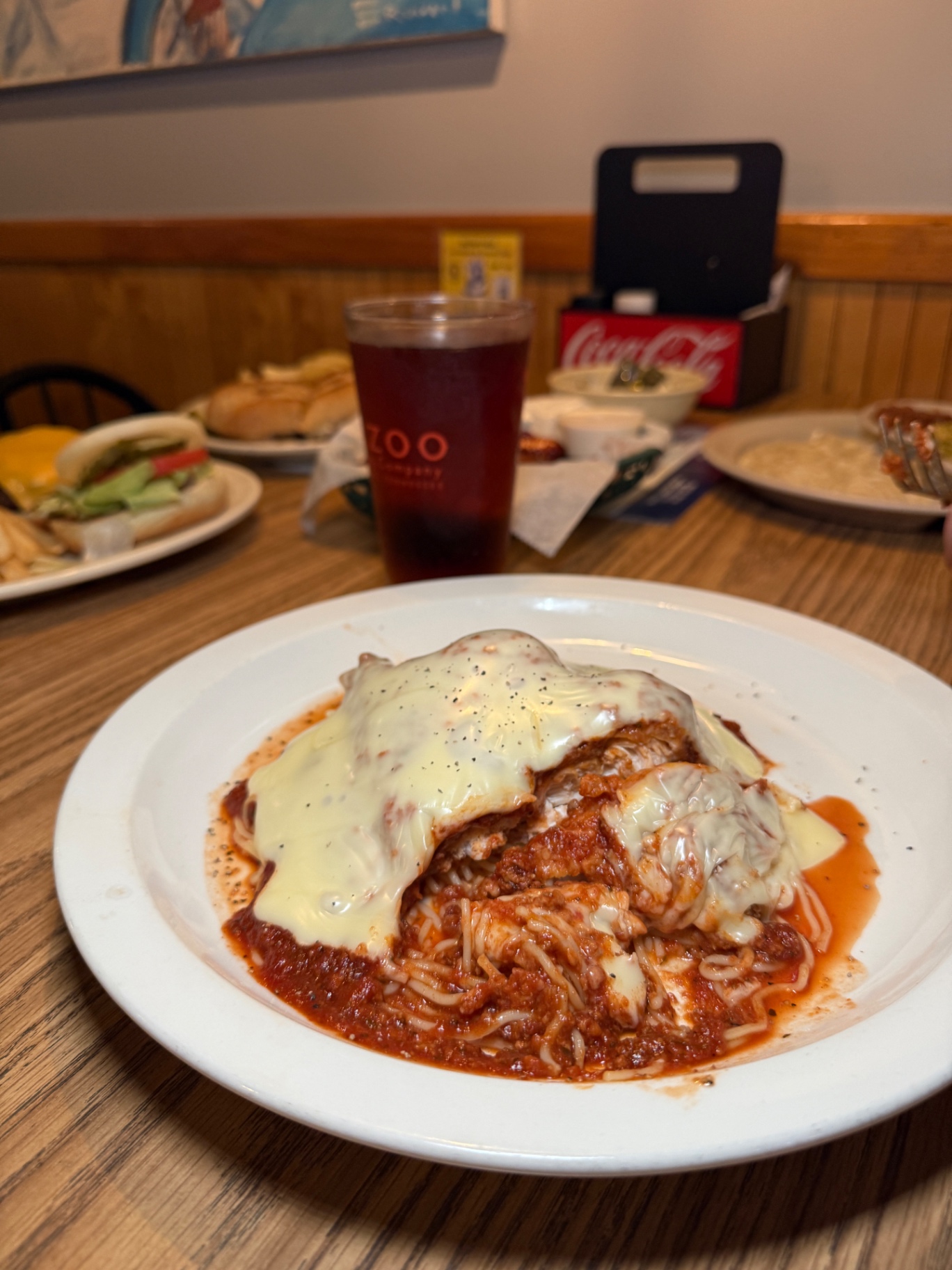 Chicken parmesan over spaghetti